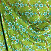 Pieni lisäkuva, jossa Trikoo digiprint kukkaruudukko vihreä